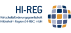 Logo der Wirtschaftsförderungsgesellschaft Hildesheim Region (HI-REG) mbH mit blau-gelbem Kachelmuster.